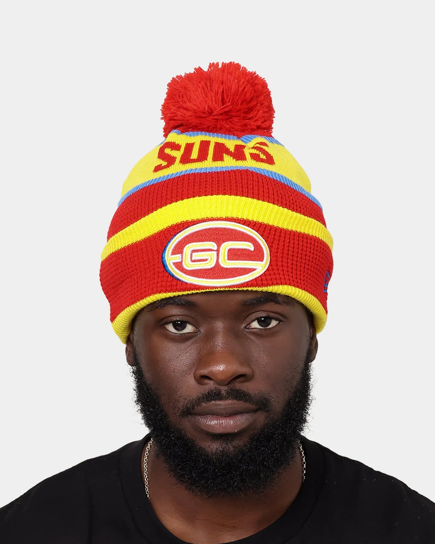 New Era Gold Coast Suns AFL Opening Bounce 2022 Pom Waffle Wordmark Beanie Red/Yellow